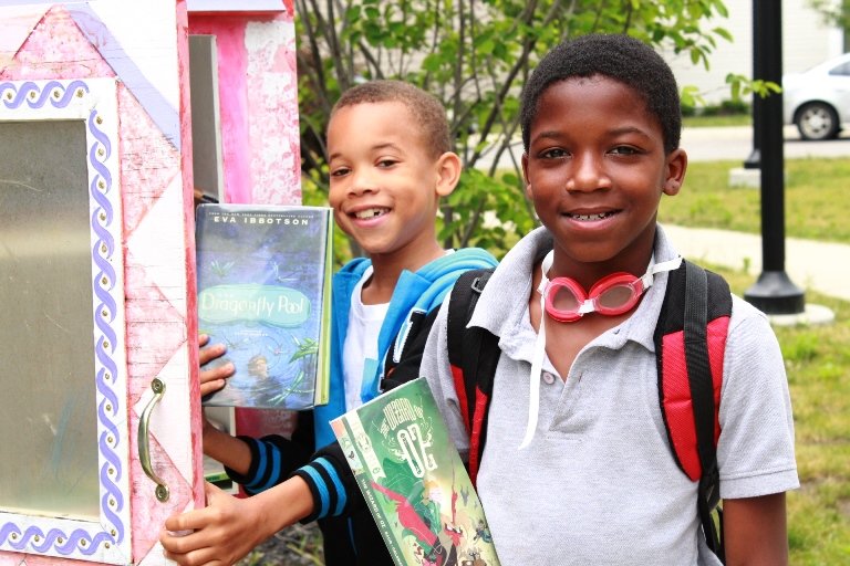 Boys at Little Free Library Boys choosing books from a local Cleveland Kids' Book Bank Little Free Library